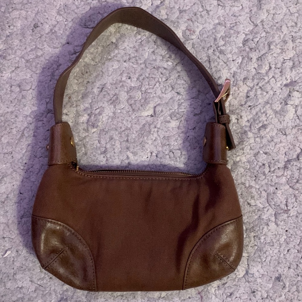Another brandy bag that’s cloth and leather gold details & such. Go for da gold!